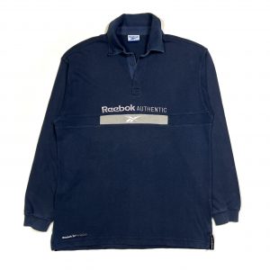vintage reebok navy long sleeved rugby shirt with embroidered centre logo