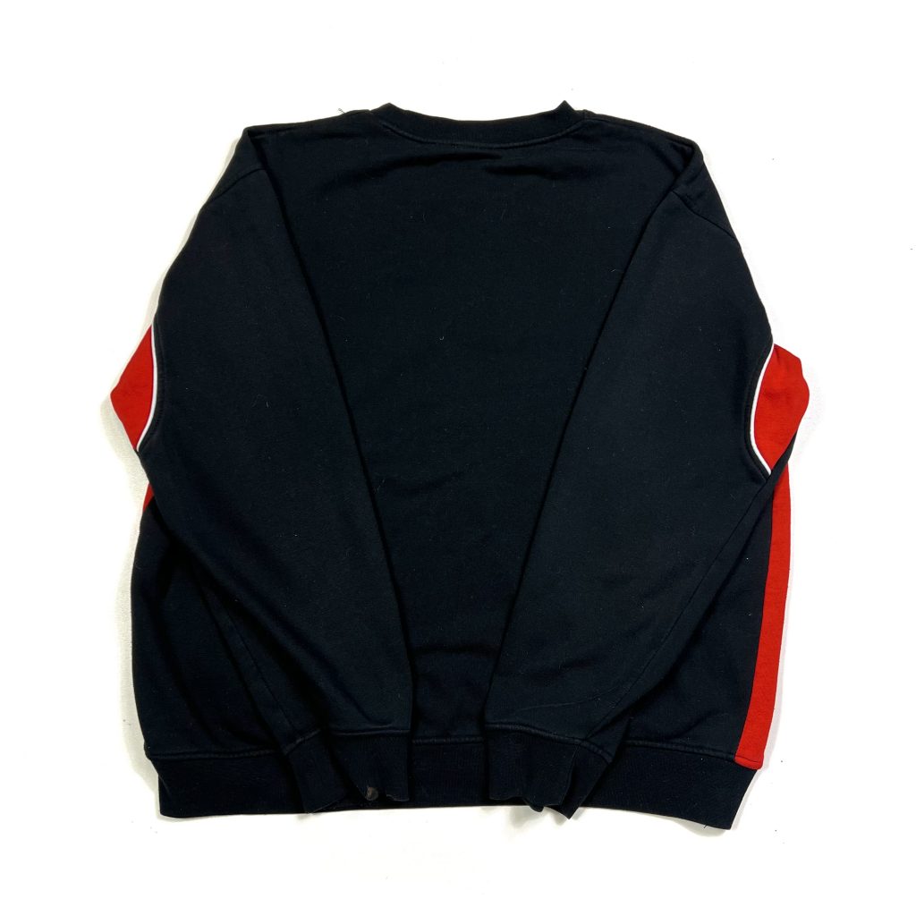 a vintage fila boxy sweatshirt in black with embroidered logo