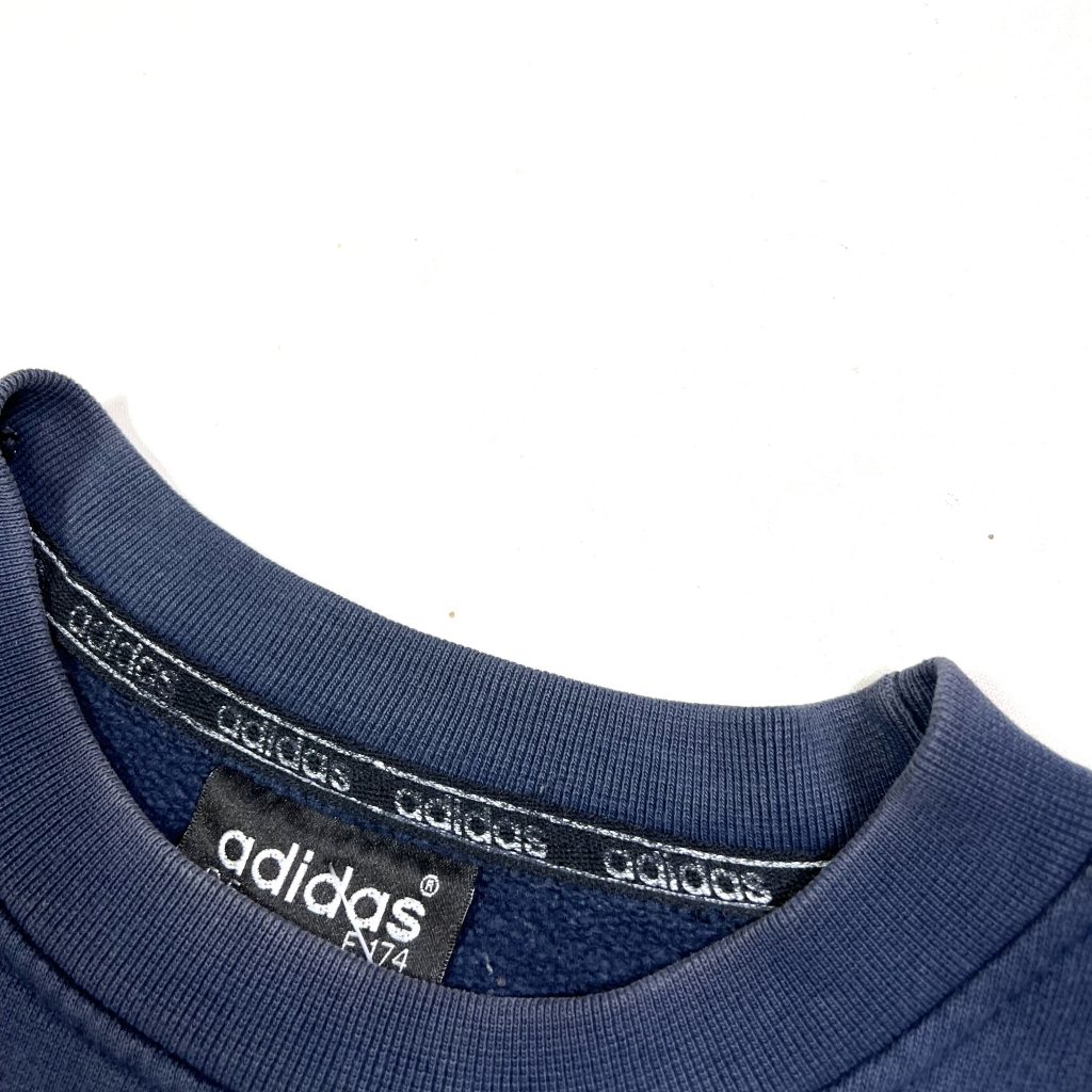 a vintage adidas originals navy sweatshirt with big printed trefoil logo
