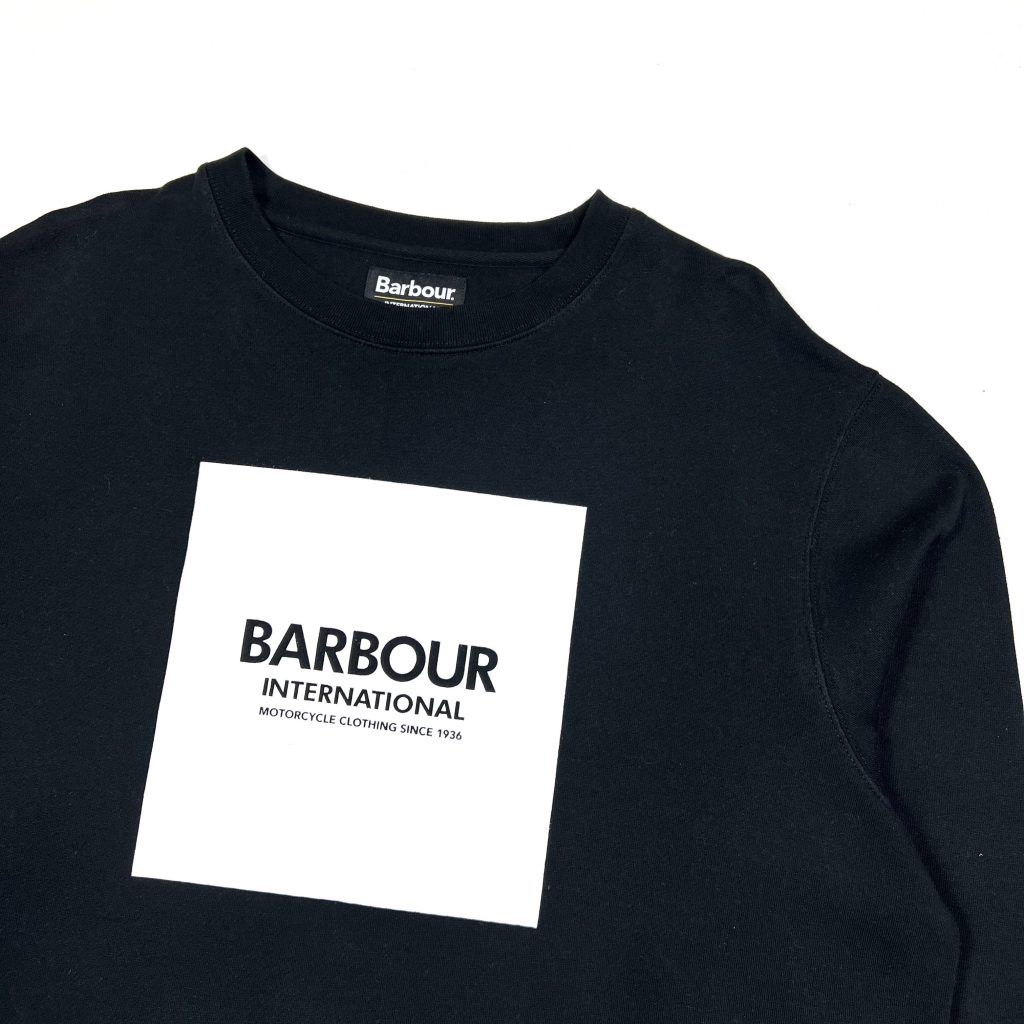 barbour black sweatshirt with printed white graphic on the front.