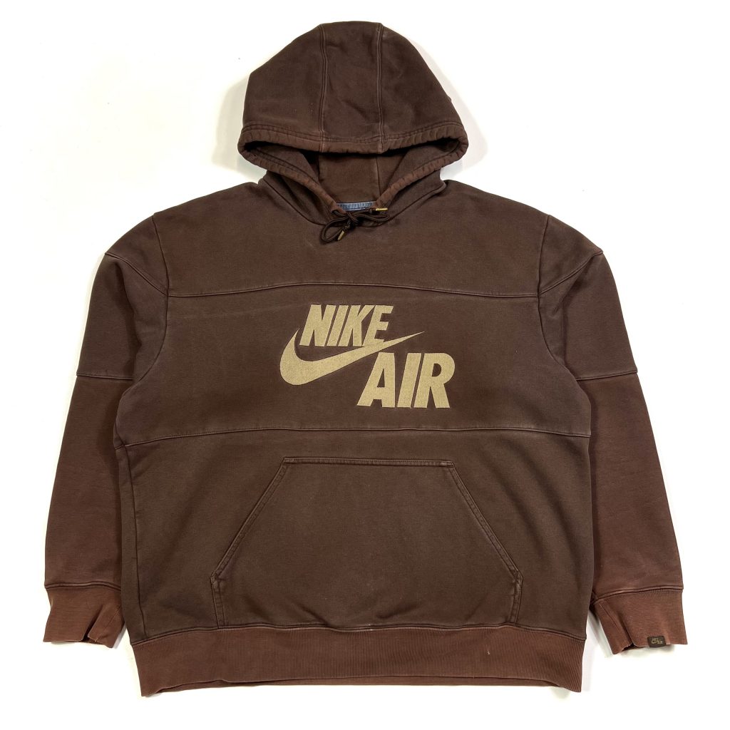 a vintage nike brown hoodie with embroidered logo