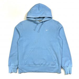 a pastel blue nike swoosh hoodie with embroidered logo