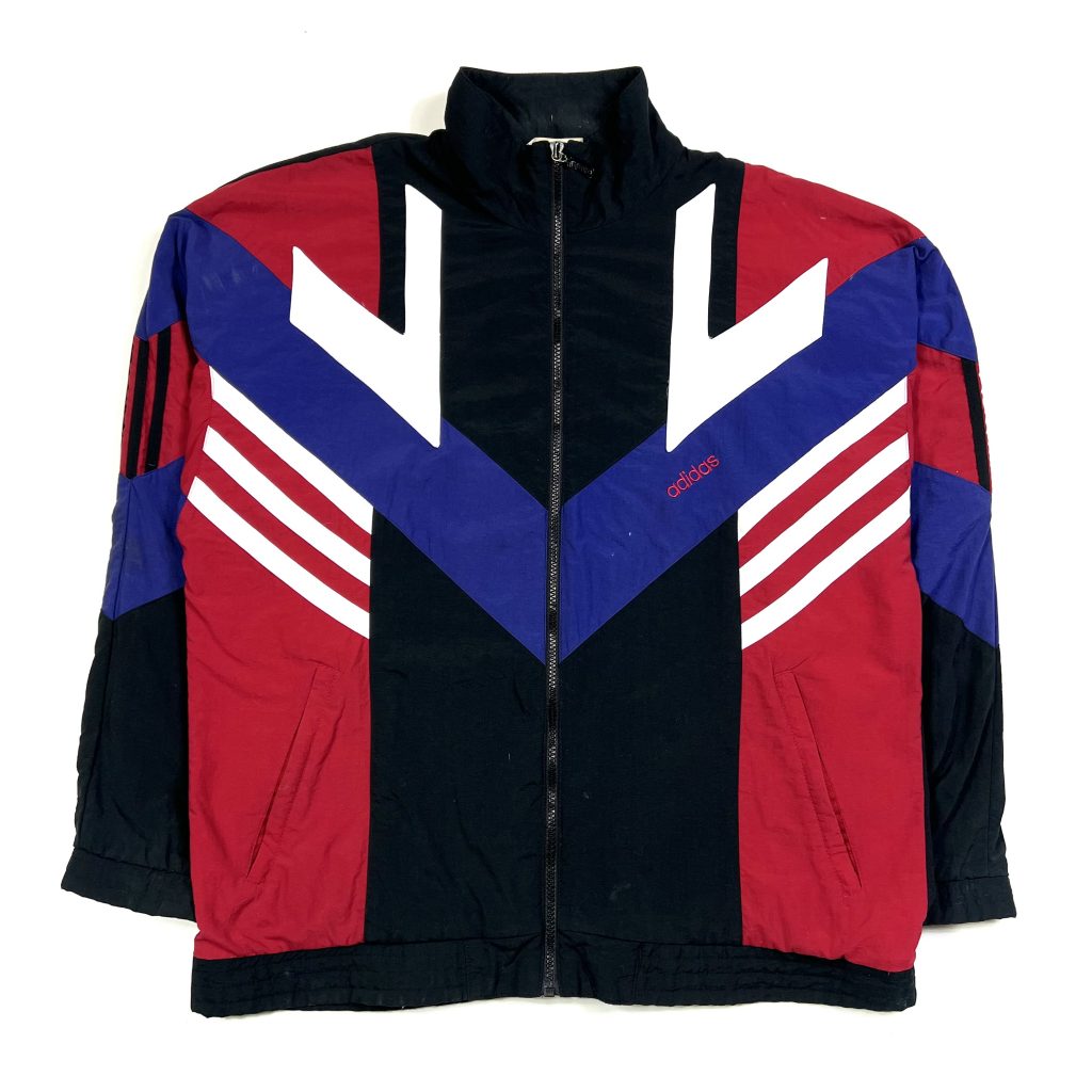 a vintage 90’s adidas black track jacket with red, white blue 3-stripes detailing