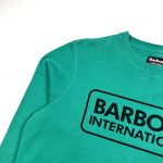green barbour sweatshirt with printed ‘barbour international’ on the front