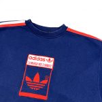 Blue Adidas oversized sweatshirt with red embroidered trefoil logo