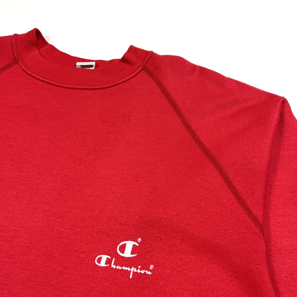 A vintage Champion essential red sweatshirt from the 90s