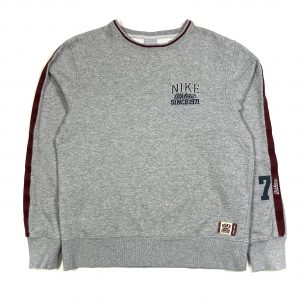 a vintage nike grey sweatshirt with miniature spell out logo