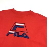 fila embroidered spell out logo on a red sweatshirt