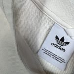 A cream vintage Adidas Adventure printed sweatshirt, size medium